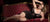 plus size model on couch wearing lingerie.